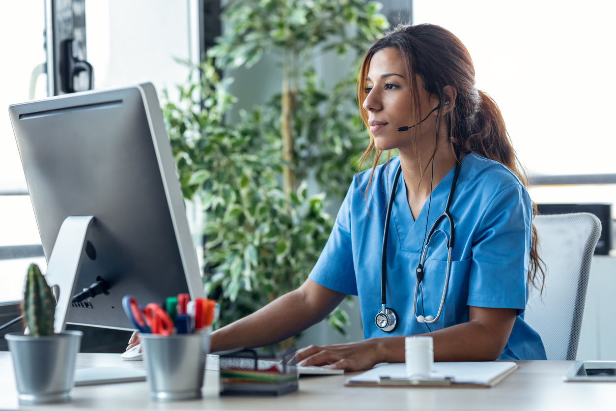A person wearing a stethoscope around her neck Description automatically generated